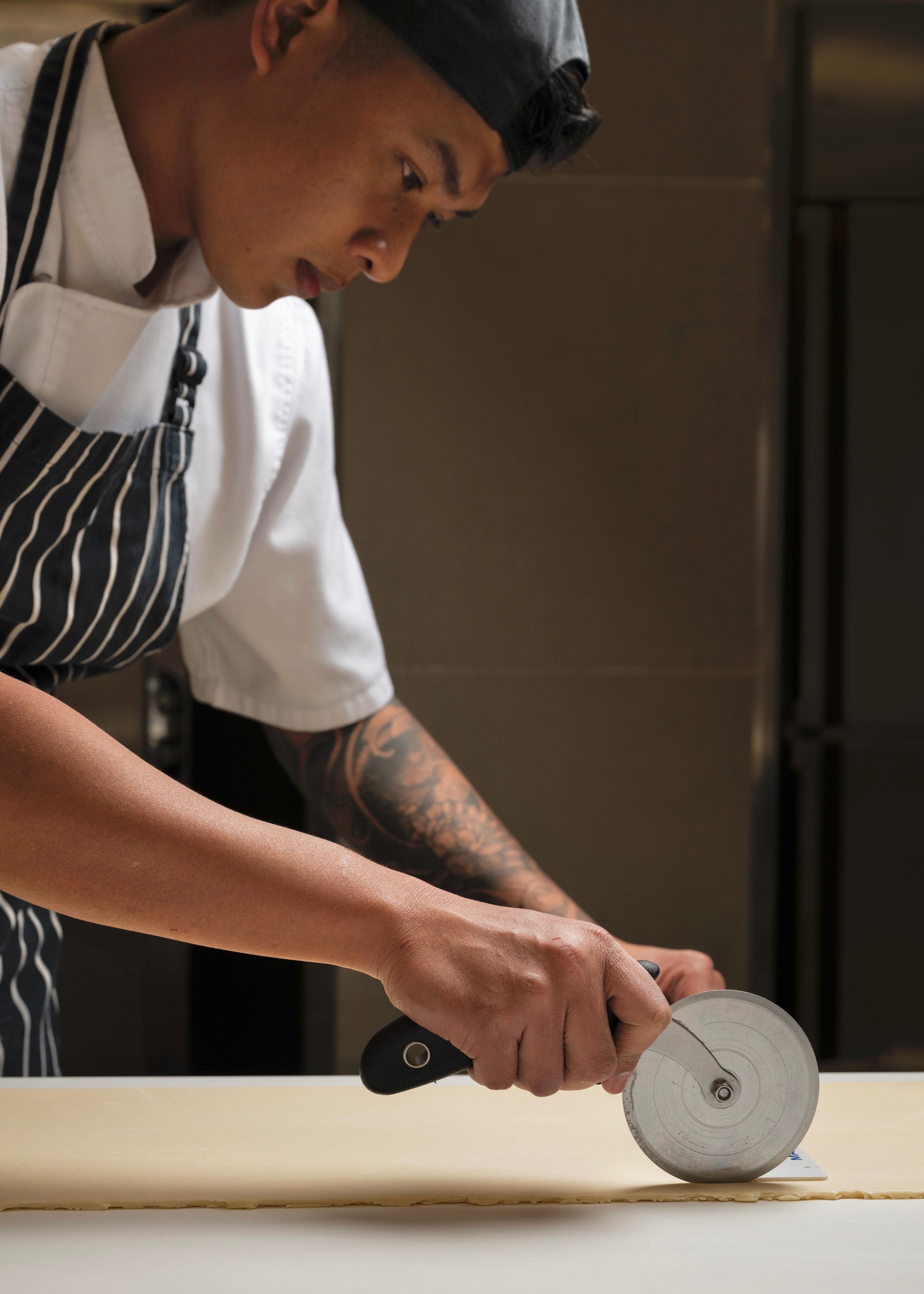 Adi using pastry wheel with precision